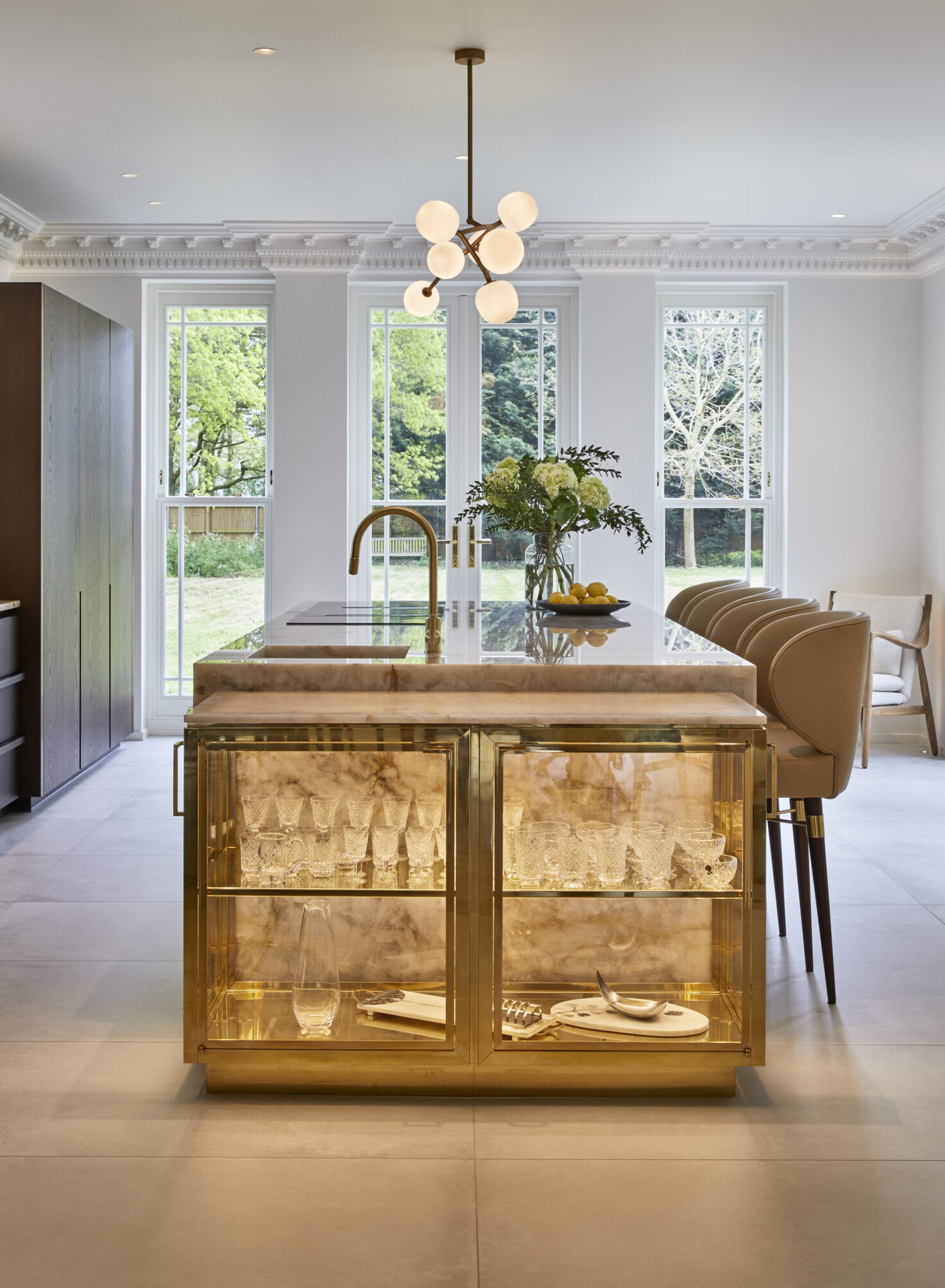 A luxury bespoke dressing room in London with dark wood and ambient lighting.