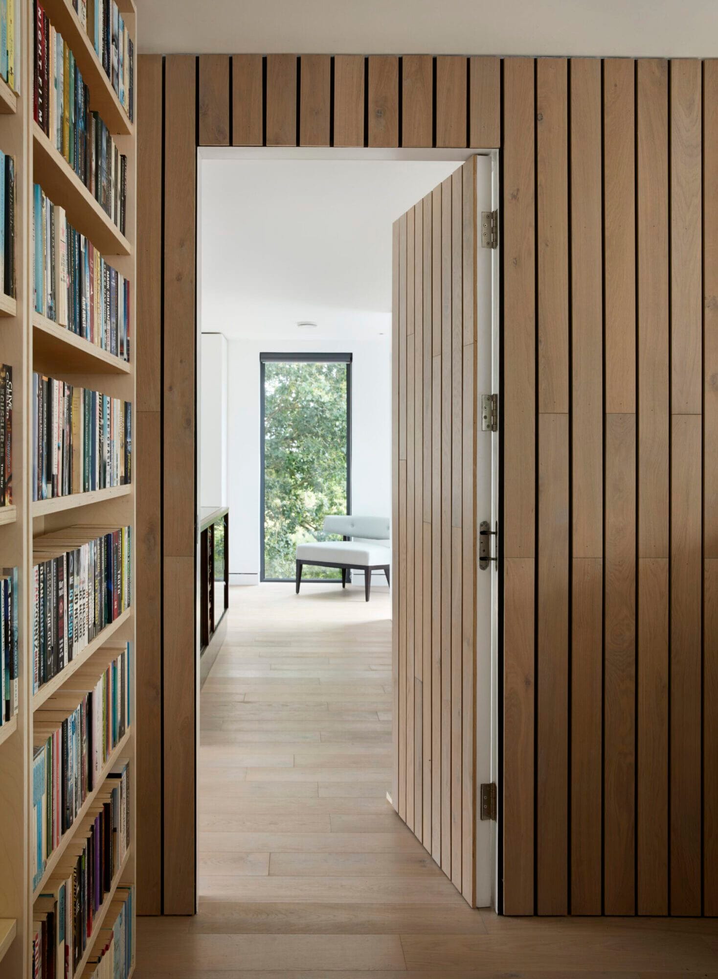 Bespoke lounge furniture including a custom media unit and shelving