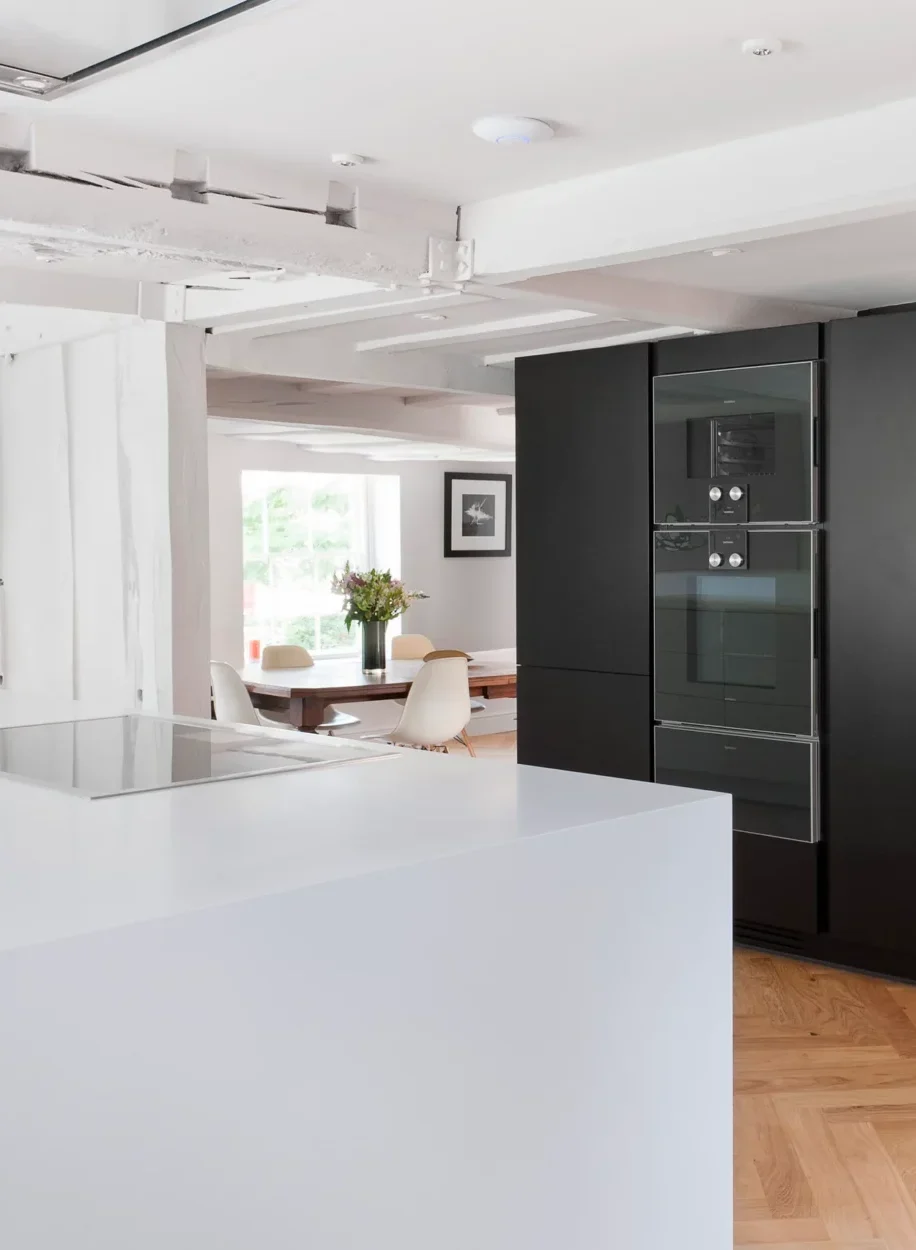 Handcrafted kitchen furniture including a bespoke dining table and chairs