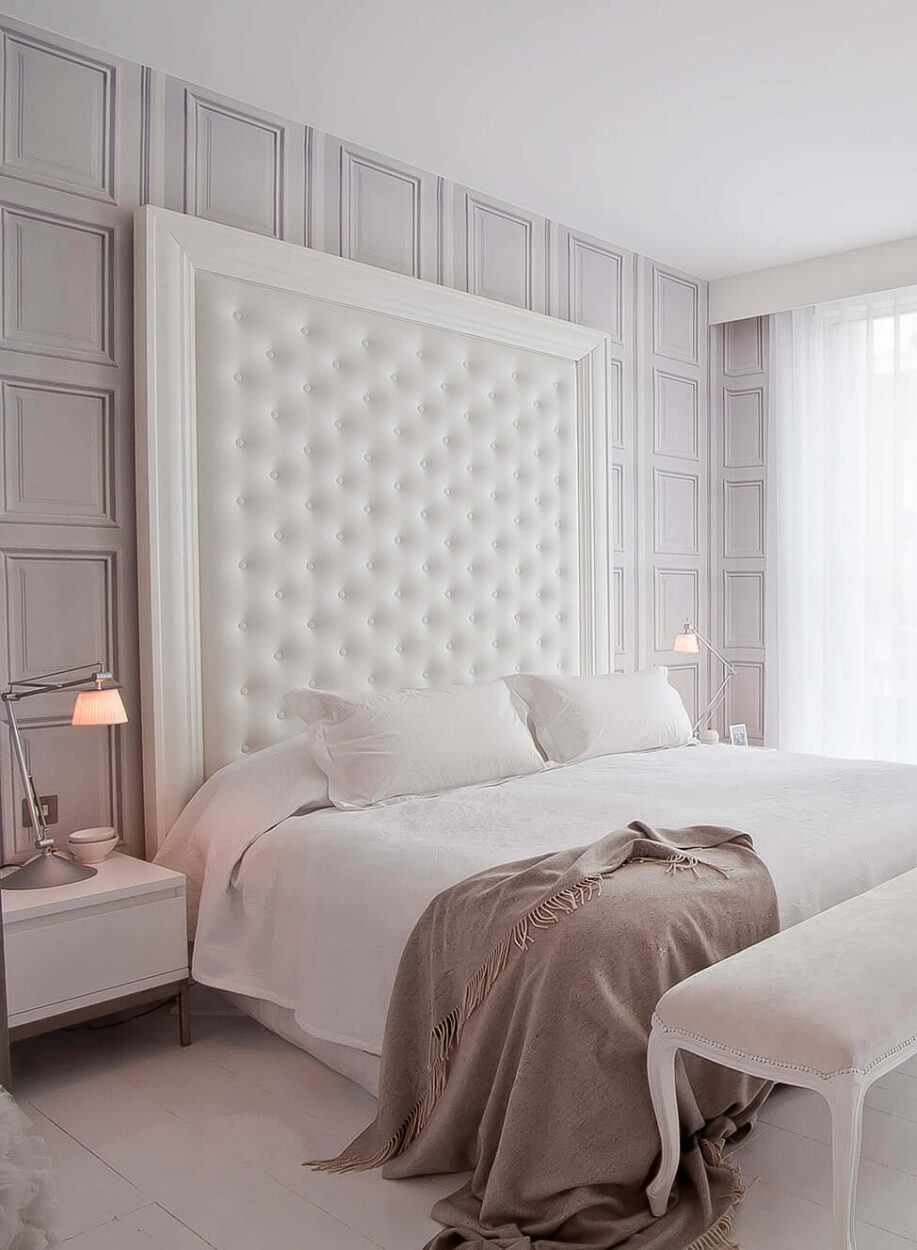 Luxury bespoke bedroom design with custom headboard and wardrobes in Essex.