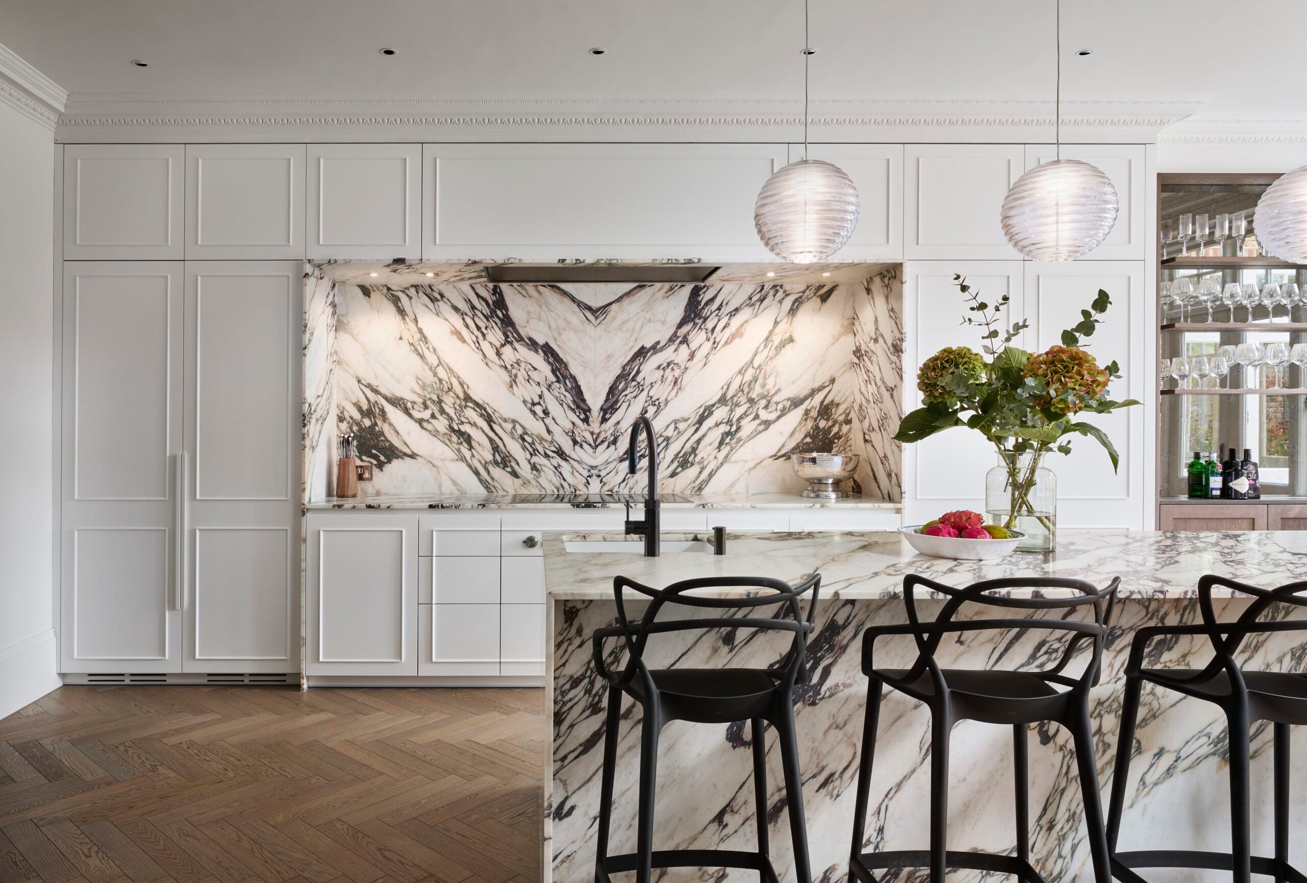Book-matched marble splashback and island breakfast bar at Victoria Road