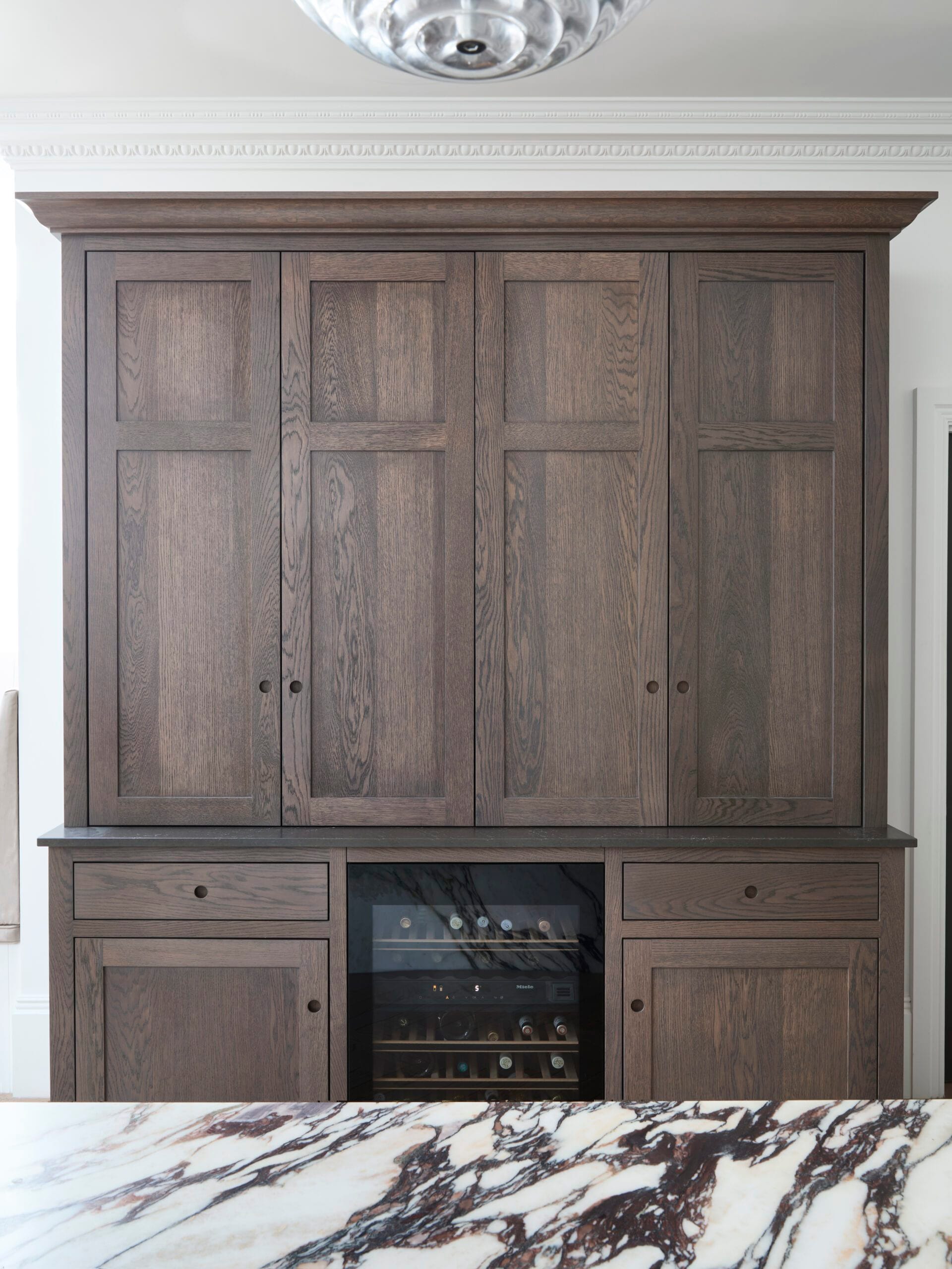 Full-height dark oak cabinetry doors at Victoria Road